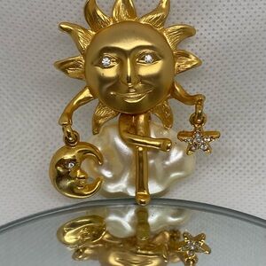Sun holds the moon and stars brooch or pendant